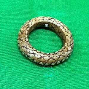 Natural Tan snake carved design. Wood or resin?